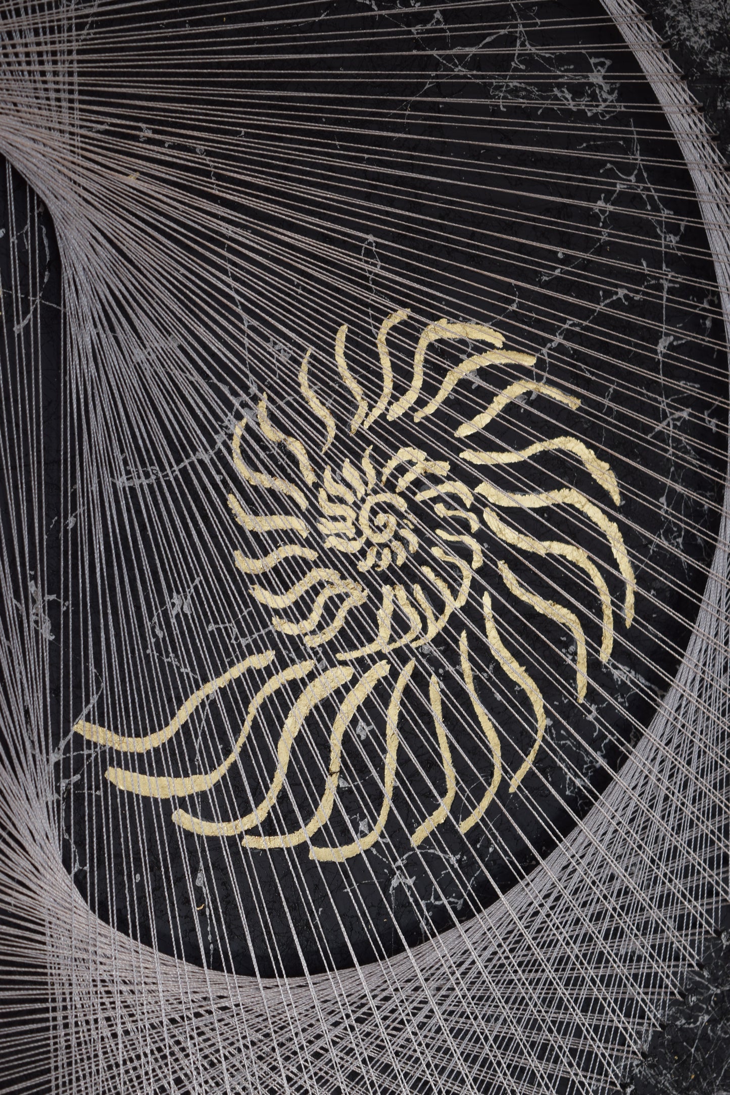 Detailed view of second gold nautilus element and thread precision in Nautilus Yin Yang string art.