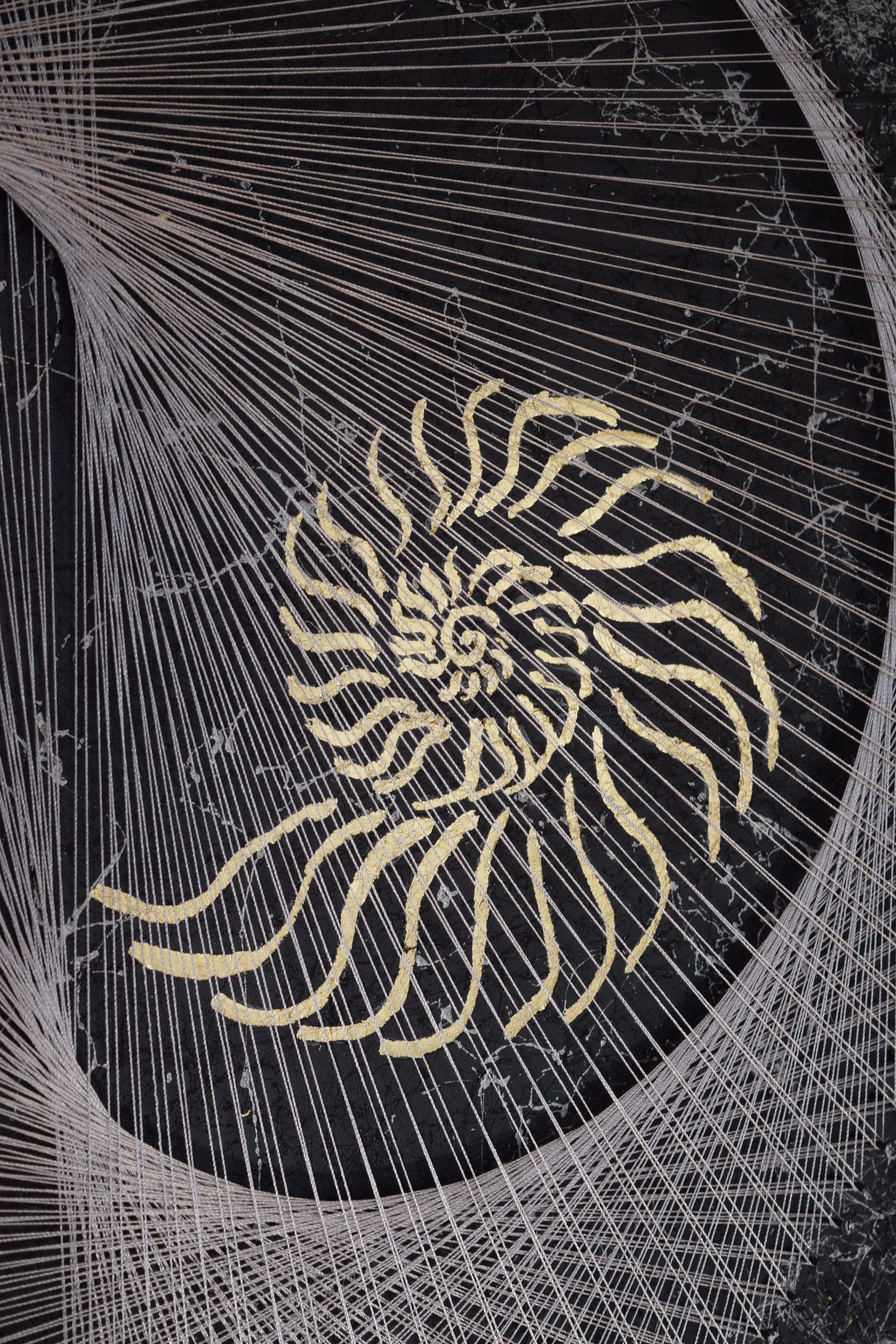 Detailed view of second gold nautilus element and thread precision in Nautilus Yin Yang string art.