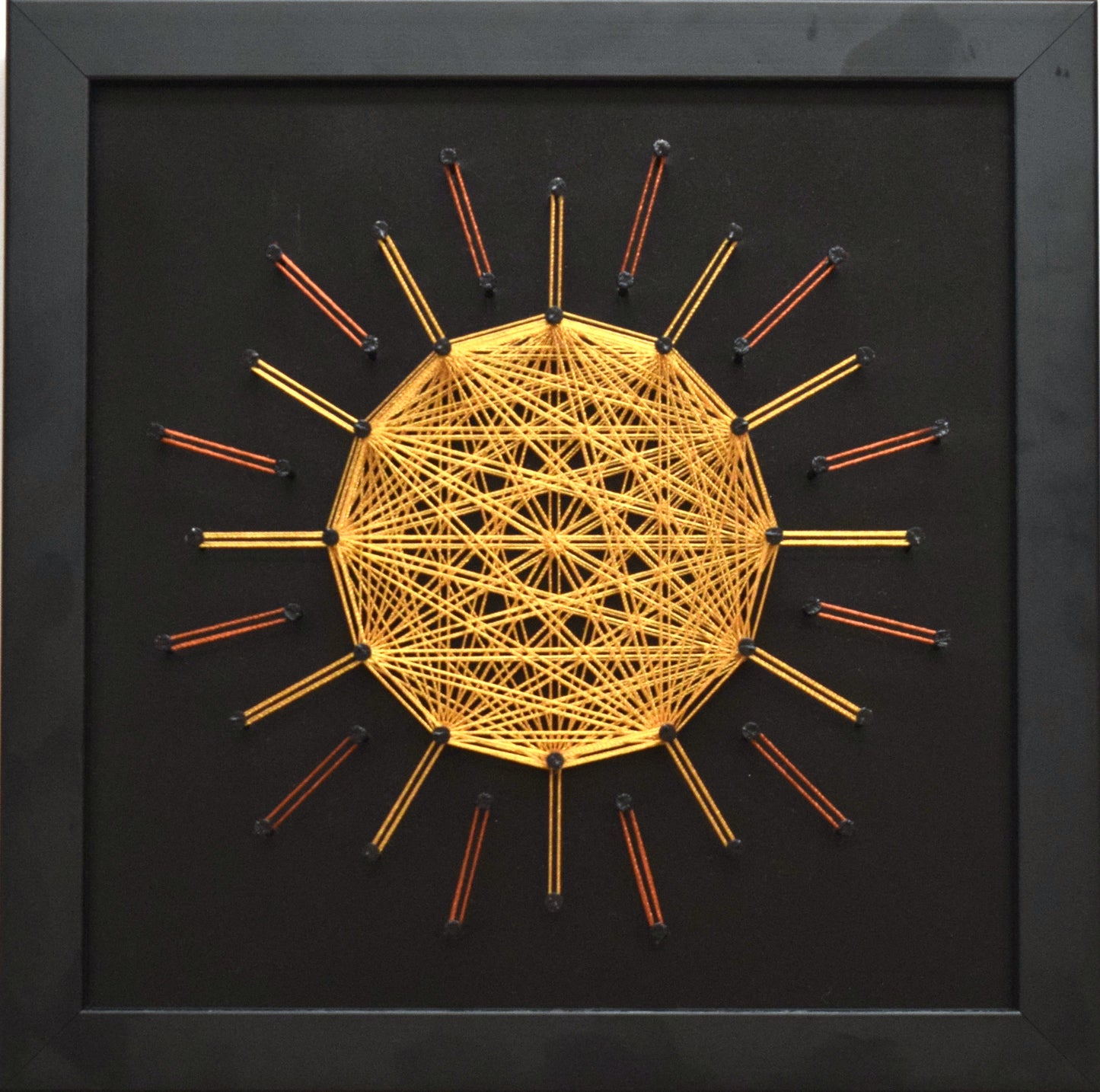 Golden string art mandala on black background – Sun symbol of vitality and inner light