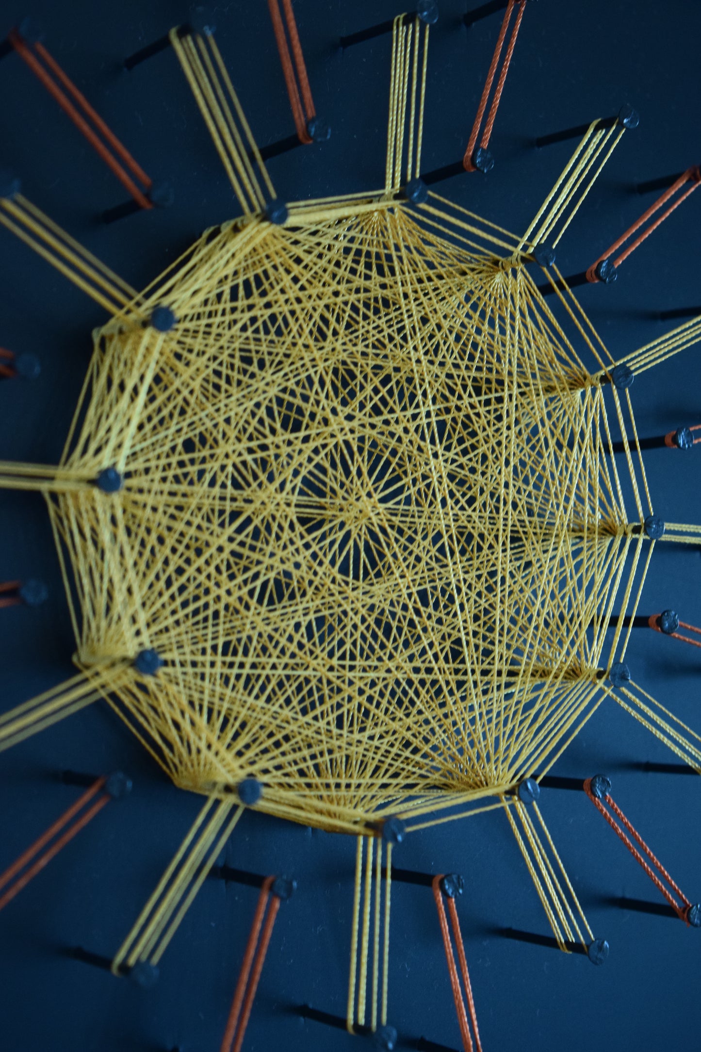 Sun Mandala 1 – sacred geometry string art in golden tones