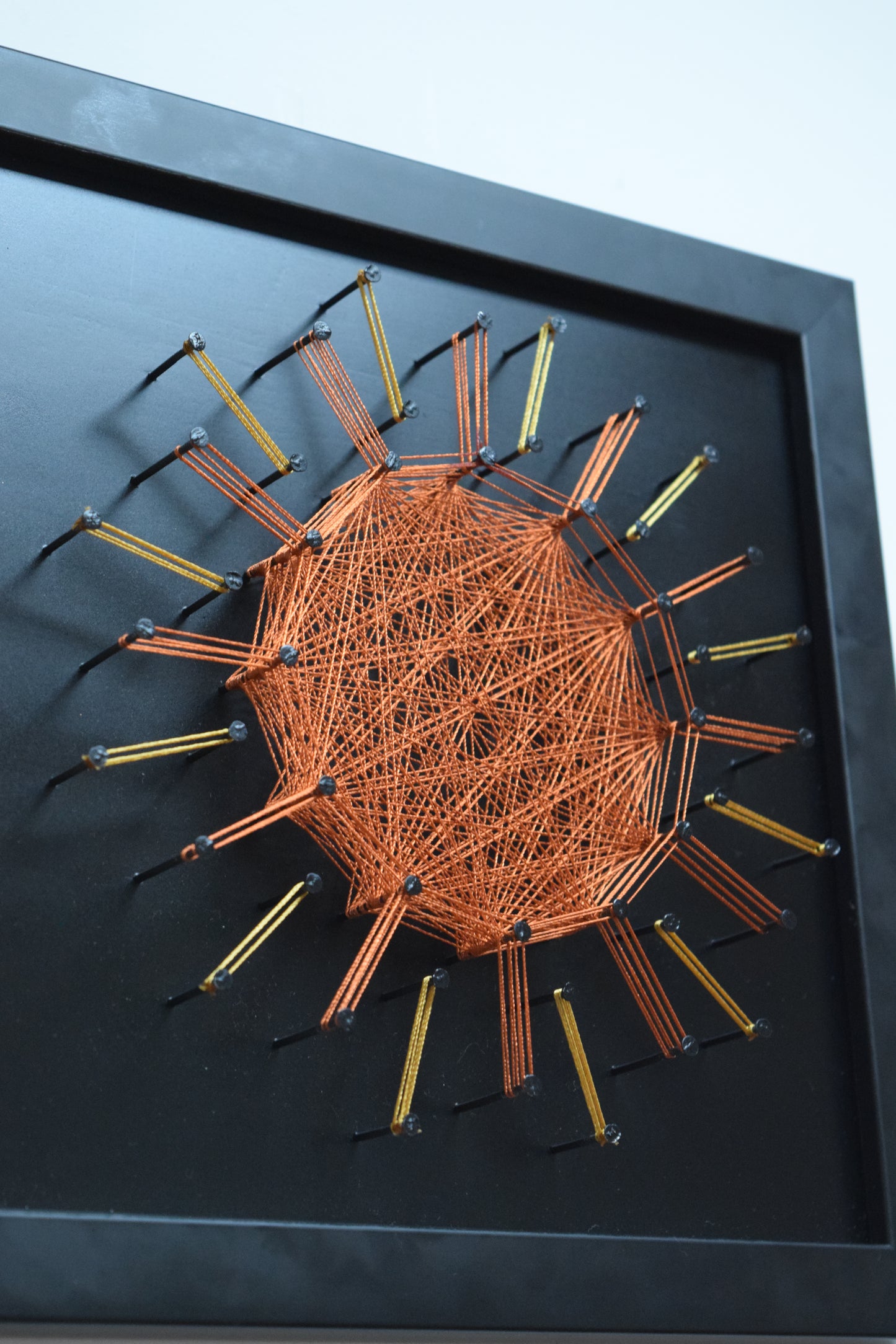 Spiritual string art mandala in copper tones – 3D geometric sun