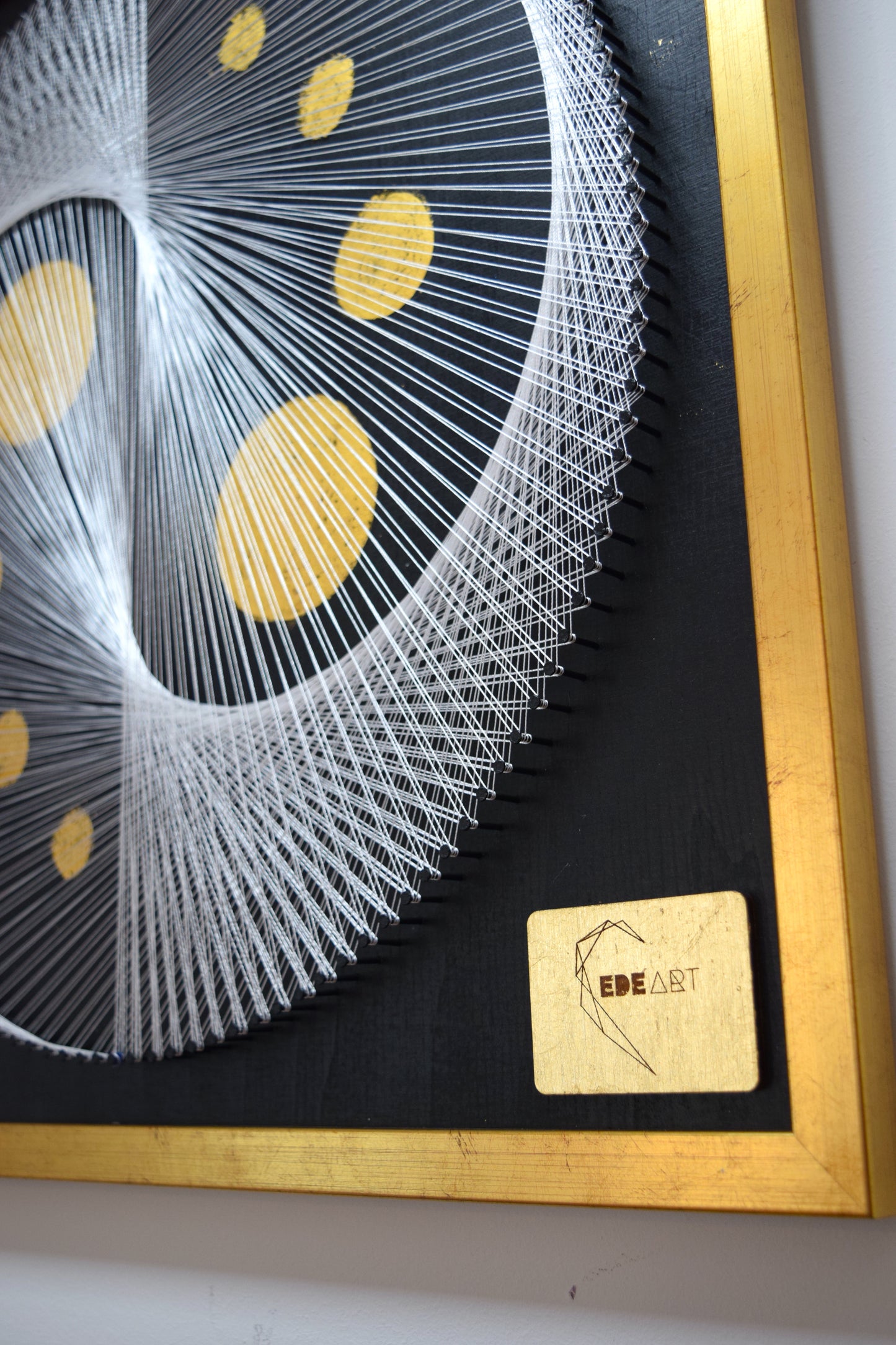 Close-up of EDEART logo and gold frame in White Yin Yang string art – premium handcrafted artwork detail.