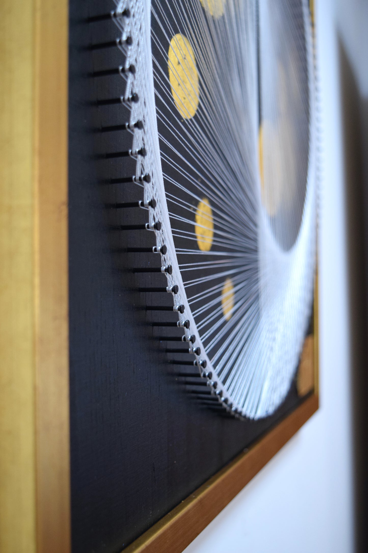 Macro shot of nails and thread in White Yin Yang string art – showcasing fine craftsmanship and durable construction.