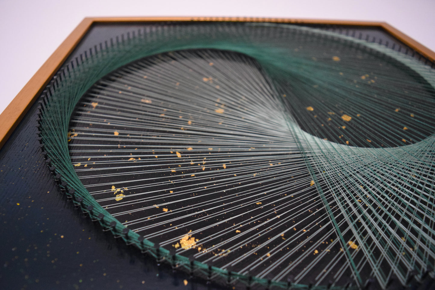 Macro photo of the thread intersection at the yin yang center, revealing precise string tension and symbolic balance.