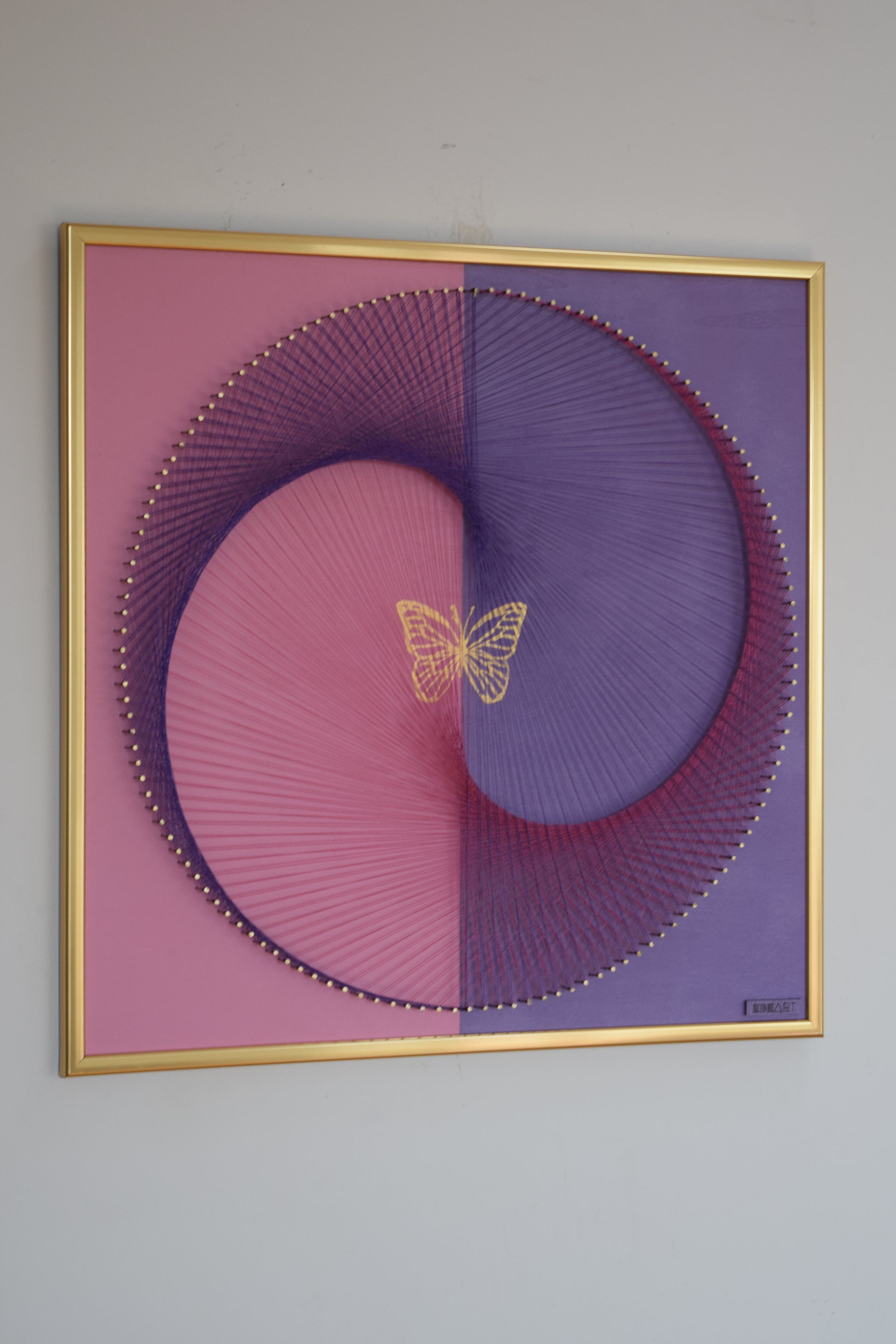 Contemporary symbolic artwork featuring butterfly and Yin Yang, created with thread and gold leaf. Spiritual and decorative piece for modern interiors.
