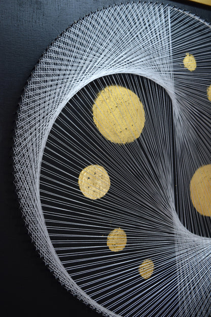 Close-up of thread structure in White Yin Yang artwork – detailed view of half the symbol, showing precision and texture.